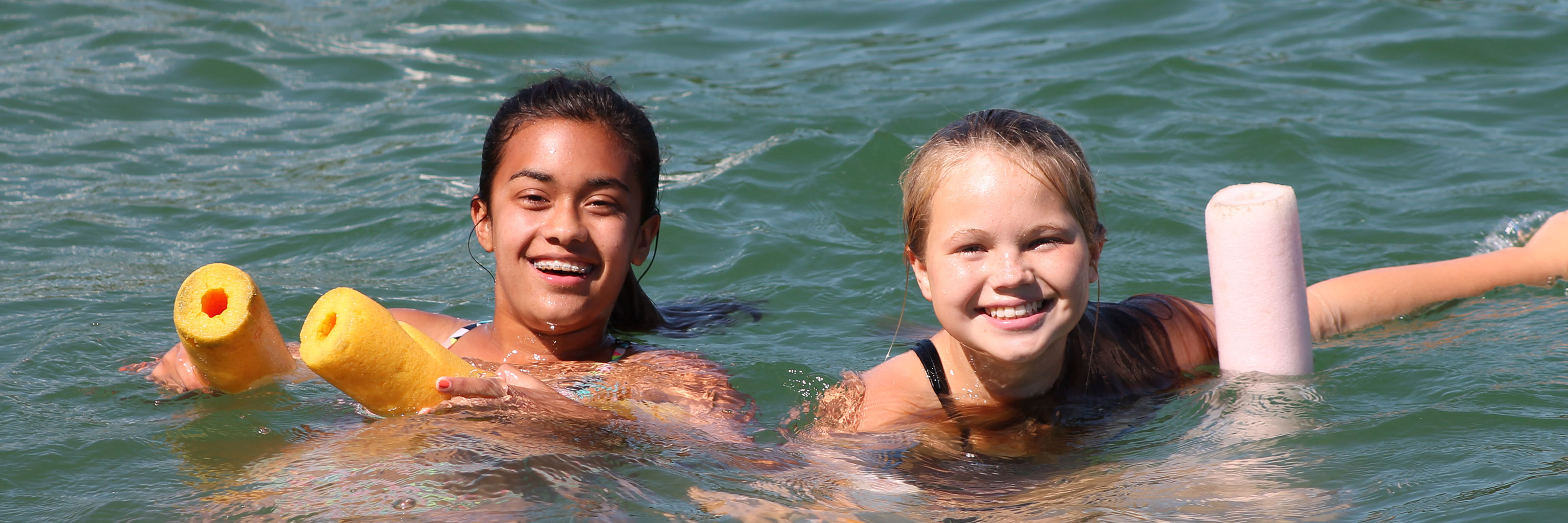 two campers in the water 